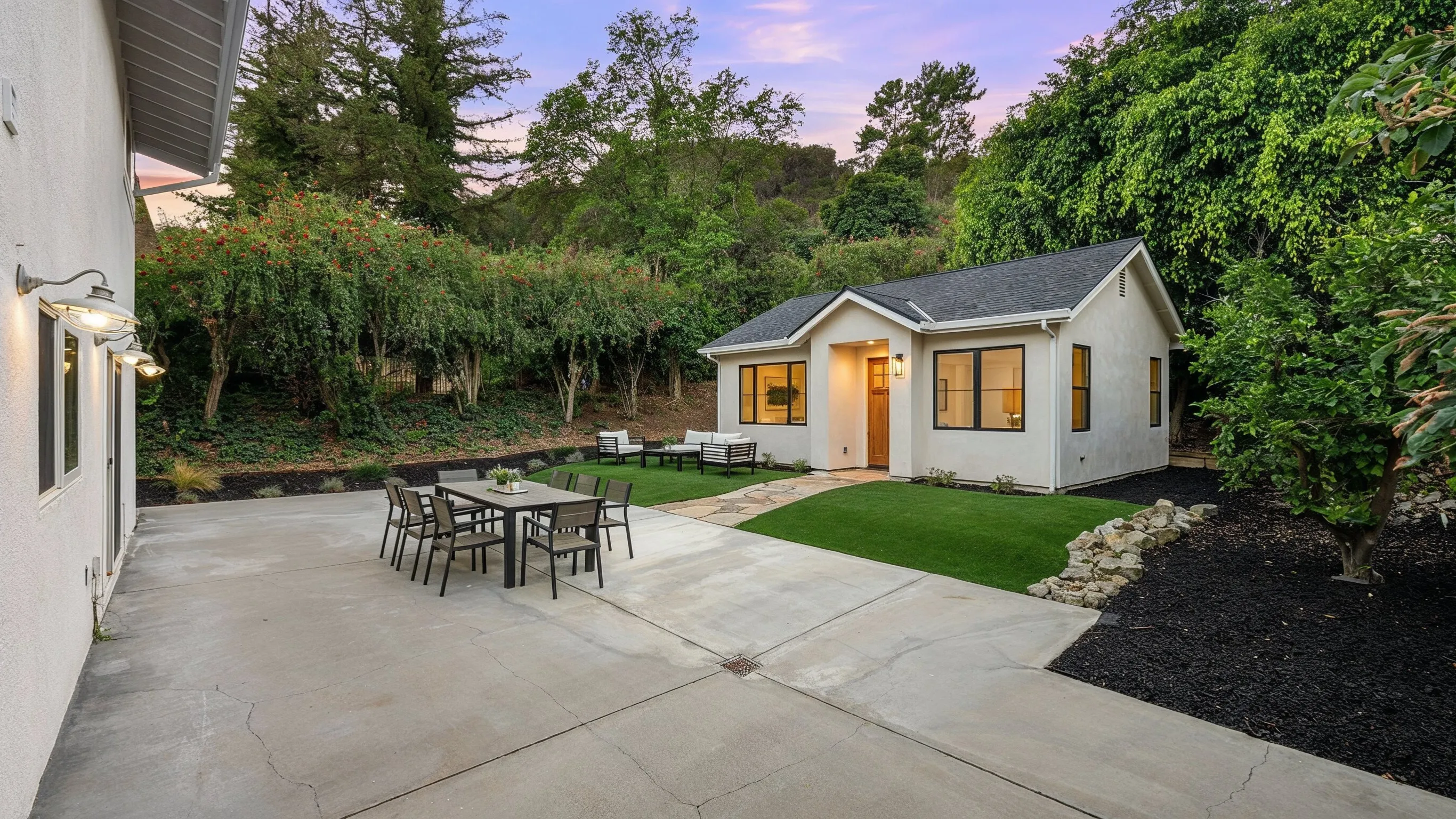 After image of a detached ADU project in Los Angeles featuring a completed backyard accessory dwelling unit with stucco exterior, private entry, windows, patio, and landscaped yard